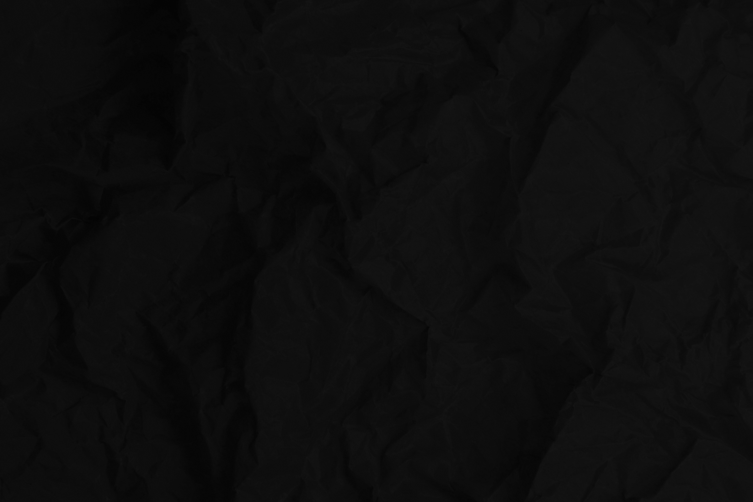 Black paper texture background, crumpled pattern, blank crumpled black paper.